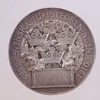 Plakett Svenska Turistföreningen 1885-1910 - Känn Ditt Land, ca Ø55mm, Erik Lindberg. 925/1000 silver  Vikt: 74 g