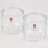 2 Ljuslyktor, Iittala, kivi, klarglas, Heikki Orvola, Marimekko, höjd 6 cm, Ø 6,5cm, repig/nagg Vikt: 0 g Skickas med paket.