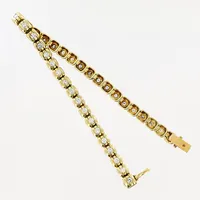 Armband, diamanter 36 x ca 0,05ct, flertalet med inneslutningar, gulguld, 18,5cm, bredd 4,7mm, 18K Vikt: 18,2 g