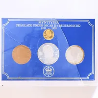 Mynttyper, Oscar II regeringstid 1872-1907, plastkassett med 2 silvermynt, 45,3g, 1 kopparmynt, 1 guldmynt 23K 4,7gr. Myntverket 1979. Skadad kassett.