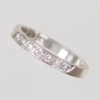 Ring, stl 17½, diamanter 7x totalt ca 0,15ctv, bredd 2,7mm, vitguld, LWP år 1964, 18K  Vikt: 3,2 g