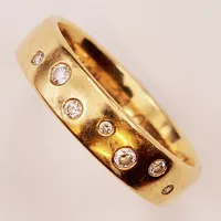 Ring, diamanter 0,13ctv enligt gravyr, Ø17½, bredd:5mm, gravyr, 18K 5,7g.