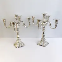 Ett par Kadelabrar 5-armade, CGH år 1936, 14delar, höjd 40cm, vidd 33cm, ljushållare innermått 2,5cm, löstagbara ljusmanschetter, silver 800/1000, bottenfyllda, vikt 3069,3g  Skickas med postpaket.