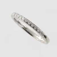 Ring med diamanter 10st totalt 0,10ct enligt inskription, stl 16½mm, bredd 1,9mm, Schalins Ringar AB , 14k vitguld Vikt: 2,6 g