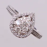 Ring med briljantslipade diamanter ca 0,50ctv, stl 16½, bredd 12,7mm, GHA, minimala repor, vitguld 18K Vikt: 4,5 g