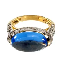 Ring, 14K guld, ljusblå Spinell 9x15 mm, troligtvis syntetisk, 66 st Cubic Zirconia, Ø18½ mm, bredd 3 - 9,5 mm, mycket fint skick, sparsamt använd, stenar utan anmärkning Vikt: 6,2 g