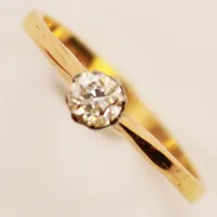 Ring, diamant ca 0,20ct, Ø16¼, bredd:4mm, 18K 1,6g.