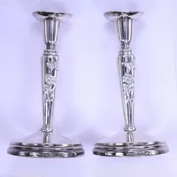 Ett par ljusstakar , Fyrklövern Mema Guld & Silver AB, höjd 16,5 cm, fyllda bottnar, etui, silver 925/1000  Vikt: 475,9 g