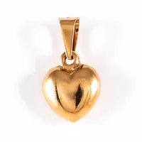 Berlock "hjärta" i 18K guld. Den är 14,8 mm lång inkl. ögla och väger 0,9g. Stämplad ALTON 18K. 