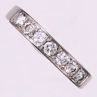 Alliansring med briljantslipade diamanter ca0,40ctv, W(H)/VS, stl 17, bredd 3,4mm, finska stämplar, år 1972, vitguld 18K  Vikt: 4,5 g
