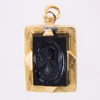 Hänge Medaljong, motiv med svart sten, längd: 30mm, bredd: 18mm, bucklig/skev, 18K bruttovikt: 9,7g Vikt: 9,7 g