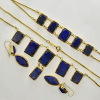 Set med Lapiz Lazuli, collier längd 42½ cm, länkens bredd 1 mm, ojämnheter/klämskador på länk, armband längd 19 cm, bredd 14-17 mm, örhängen längd ca 40 mm, bredd 12 mm, 18K. Brutto Vikt: 46,1 g