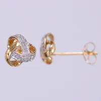 Ett par örhängen med diamanter, 4 x ca 0,005ct, längd ca 8mm, bredd ca 7,7mm, vitguld och gult guld 18K Vikt: 1,6 g