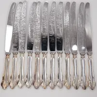 12 Matknivar, 25cm, blad i rostfritt stål, monogram gravyr, MGAB, Silver 800/1000 bruttovikt 817,6g 
