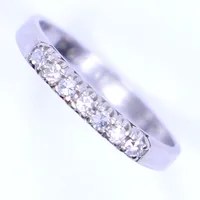 Ring med diamanter totalt 0,15ct enligt gravyr, stl 16¼, bredd 2-2,5mm, vitguld, gravyr, 18K  Vikt: 1,9 g