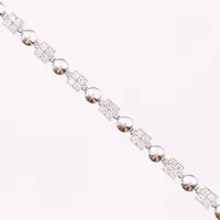 Armband, Bvlgari, "Lucea" med diamanter ca 68 x 0,02ct, längd 18½ cm, bredd 4mm, 18K vitguld Vikt: 18 g