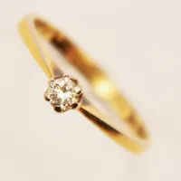 Ring, diamant 0,12ct enligt gravyr, Ø17¼, bredd:4mm, gravyr, 18K 2,2g.