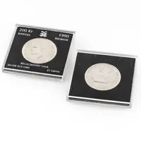 Två minnesmynt "REGALSKEPPET VASA" i silver från 1990 i plastetuier. Nominellt värde totalt 400kr. Totalt 54g 925/1000.