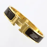 Armband, Hermès Clic Clac H, guldfärgad metall med brunemalj, ca 55x45mm, bredd 12mm, märkt Hermès Q SP, Made in France, bredd:11,5mm, dustbag, ask, folder, repor finns