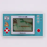 Spelkonsol Game&Watch Nintendo Donkey Kong JR, modell DJ-101, serienr 20605682, bruksslitage, sliten originalförpackning. 