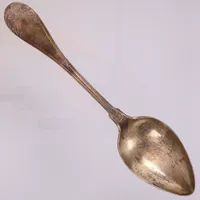 Sked, längd 22,5cm, modell Gammalfransk, gravyr: Till August Dahm från gudmor, stämplad BH, år 1838, 830/1000 silver Vikt: 69,6 g