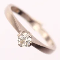 Ring med diamant, 0,24ct enligt gravyr, stl 18½, bredd 2-4mm, 18K Vikt: 3,5 g