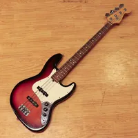 Elbas Fender Jazz Bass "Sunburst", 1990 tal, made in U.S.A, nummer N576402, bruksslitage, mjukt fodral. Skickas med Bussgods eller PostNord