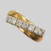 Ring, briljantslipade diamanter 7 x ca 0,10ct, ca Wesselton(H)/SI, Ø17, bredd 6-7,5mm, vitguld/ rödguld/roséguld, 18K  Vikt: 8 g