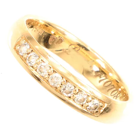 Ring med diamanter 0,21ct, enligt gravyr, stl17½, bredd ca 4mm, graverad, 18K  Vikt: 3,7 g