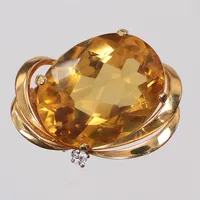 Hänge/Brosch med diamant 1 x ca 0,04ct samt gul sten möjligen citrin eller topas, ca 30x20mm, gul sten något lös i fattning, 18K Vikt: 9,4 g