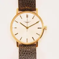 Herrur Longines 18K, 34mm, manuell, boettnr:4030-4 6942, snr:17057966, Cal.6942, slitet läderband med originalspänne, graverad bakboett. Vikt: 0 g