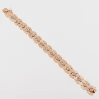 Armband röd och vitguld, längd 18.2 cm, bredd 12.7 mm, 18k. Vikt: 21,8 g