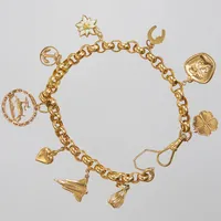 Armband, ärtlänk, 2,5cm, bredd: 6,5mm, 9 berlocker, 18K Vikt: 14,8 g