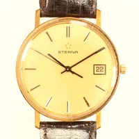 Armbandsur Eterna 18K Ø 33mm, quartz, datum, läderband, längd inklusive ur ca 22cm, bruksskick, bruttovikt 25,51g Vikt: 0 g