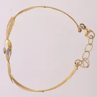 Armband halvstelt, innermått ca 19cm, justerbar, bredd 5-16mm, tvåfärgat, skevt, 18K  Vikt: 8,1 g