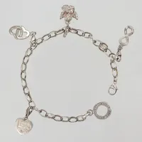 Armband med fyra berlocker  Thomas Sabo 19,5cm bredd 4mm, silver 925/1000 Vikt: 17,3 g