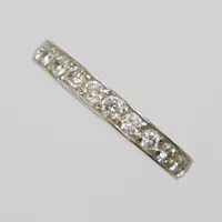 Ring, helallians, briljantslipade diamanter 24 x ca. 0,03ct, ca W/VS, Ø16½, bredd: 2,8mm, gravyr, vitguld 18K Vikt: 4,1 g