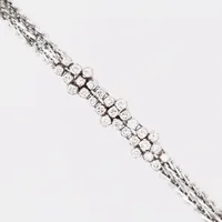 Armband, briljantslipade diamanter totalt ca 2,00ct, kvalitet ca TW-W(G-H)/VS, längd 18½cm, bredd 9mm, svenska importstämplar, 18K vitguld   Vikt: 24,2 g