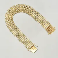 Armband X-länk, längd 19½ cm, bredd 15 mm, klämskador samt ojämn länk, slappa lås åttor, 18K. Vikt: 21,6 g