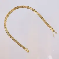 Armband 18,5cm bredd 4mm små vikskador 18K  Vikt: 8,5 g