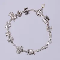 Armband Pandora med 11 berlocker, längd: ca 19,4cm, bredd: ca 3mm, 925/1000, Silver  Vikt: 44,3 g