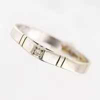 Ring, diamant ca 0,01ct, stl 20, bredd 2,5-3mm, vitguld, repig, 18K.  Vikt: 2,5 g