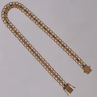 Armband x-länk, längd 23cm, bredd 6,2mm, 18K  Vikt: 14,4 g