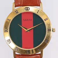 Herrur Gucci Ø33mm ref nr. 3000.2.M snr. 0347082, förgyllt stål, quartz (går ej i behov av batteribyte), med läderband i nyskick (ej original) med grön originallåda 1990-tal 