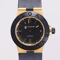 Armbandsur Bvlgari Diagono, 18K/titan, automatisk, 32mm, refnr AL 32 GVD, serienr L1137, datum, gummiarmband, viklås 18K, spår av användning, certifikat daterat 10/12/2005 Hilton International Singapore, box, ytterkartong. 