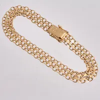 Armband i 18K guld, 18cm, X-länk, bredd 7,9mm, tillverkad av NSE guldvaru AB, år 1966, vikt 8,84g.