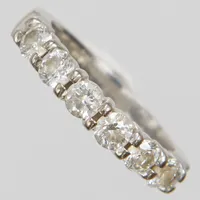 Ring, briljantslipade diamanter 6 x ca. 0,10ct, ca Wesselton-TCr/SI, varav  två möjligen syntetiska, Ø16½, bredd: 3mm, GHA, vitguld, 18K Vikt: 5 g