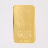 Guldtacka UBS, serie-nr: 382891, 40,5x23,3mm, bruten plombering, borrhåll, 999/1000 24K.  Vikt: 20 g