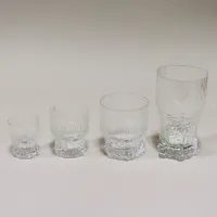 Glasservis Aslak Iittala, design Tapio Wirkkala, 11 glas 13,5cm, 11glas 10cm, 10 glas 9cm, 12 glas 7,5cm, 18 mindre glas i två snarlika modeller 6cm varav 6 st saknar kartong, övriga i originalkartonger med slitage samt några saknar yttre botten. Skickas med Bussgods eller PostNord