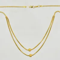 Collier med matterade kulor, längd 41½ cm, länkens bredd 2 mm, 21K. Vikt: 7,1 g